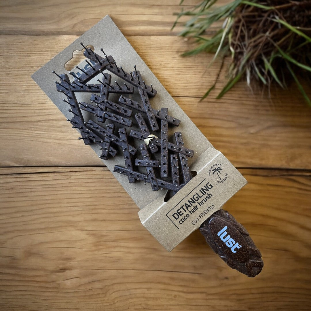 Our coco detangling brush+ packaging by Lust Haircare