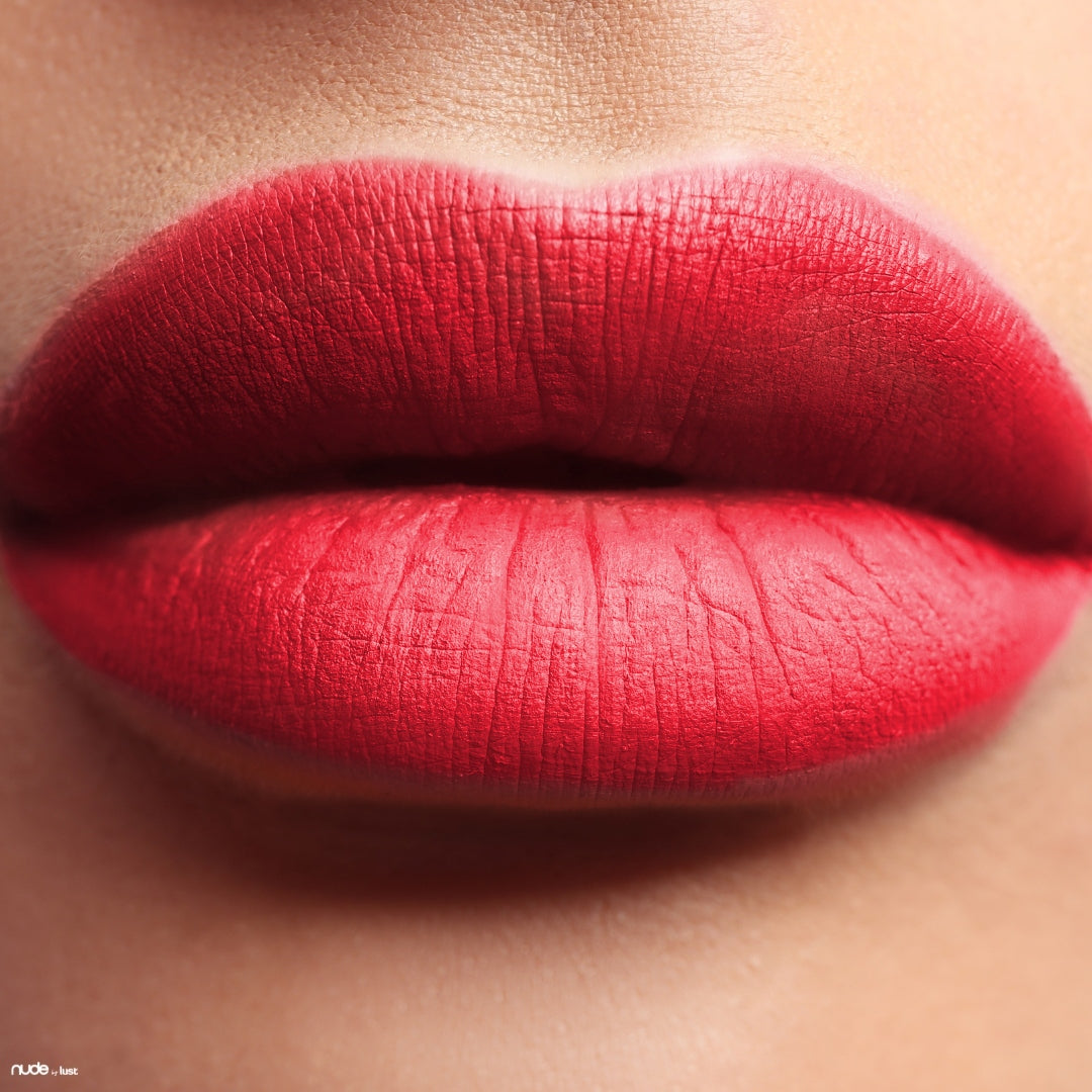 Coral red lipstick from Nude by Lust