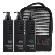 Image of Lust Haircare Christmas pack for Scalp care showcasing sulphate-free shampoo, conditioner and a body wash with a beauty bag in the background 
