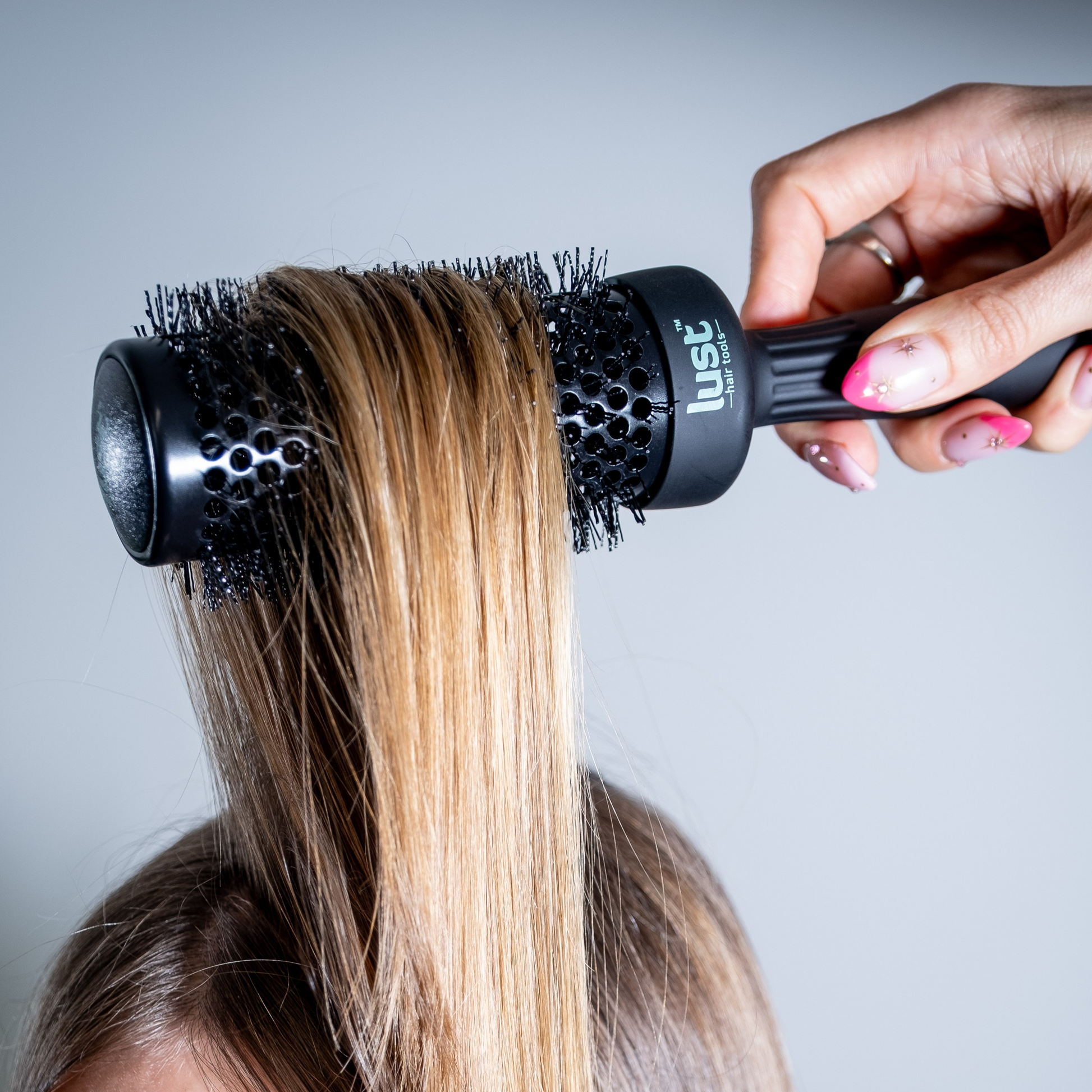 Lust haircare NZ luxury ceramic brush in action - lust hair product